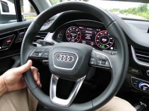 The Audi Q7 Dashboard, features a screen with analog style gauges and plenty of information for the driver.