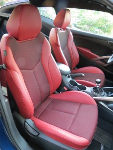 Red leather bolstered seats & door inserts, and matching seat belts give the Hyundai Veloster R-Spec an sporty look and feel.