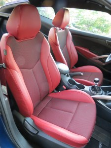 Red leather bolstered seats & door inserts, and matching seat belts give the Hyundai Veloster R-Spec an sporty look and feel.