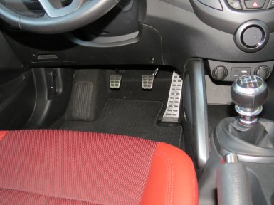 Studded chrome sport pedals are some of the many extras in the Hyundai Veloster R-Spec, a lot of sports car, for very little money.