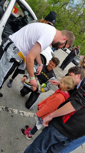 Reality TV Star Rutledge Wood and Champion racer Craig Stanton, sign autographs at the 2016 One Lap America stop at Summit Point Raceway