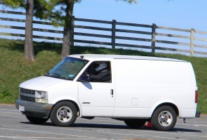White Chevrolet Astro Van Autocrossing