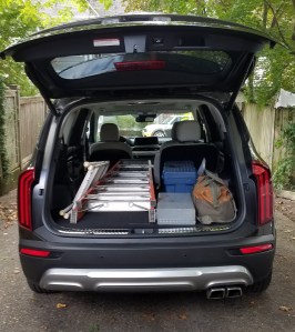 2020 Kia Telluride cargo area 2nd row split down loaded with ladders and tool bag.