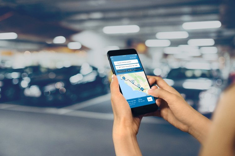 Close up of hands working on smartphone on the go