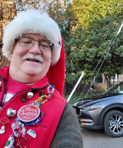 William West Hopper festivly dressed for the 2019 Old Town Alexandria Virginia Scottish Walk Parade in front of a 2019 Mazda CX5