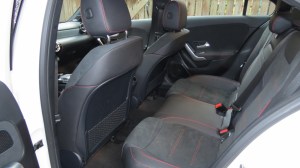 Rear Seats in the A220. Seats are black DINAMICA with red contrasting stitching.