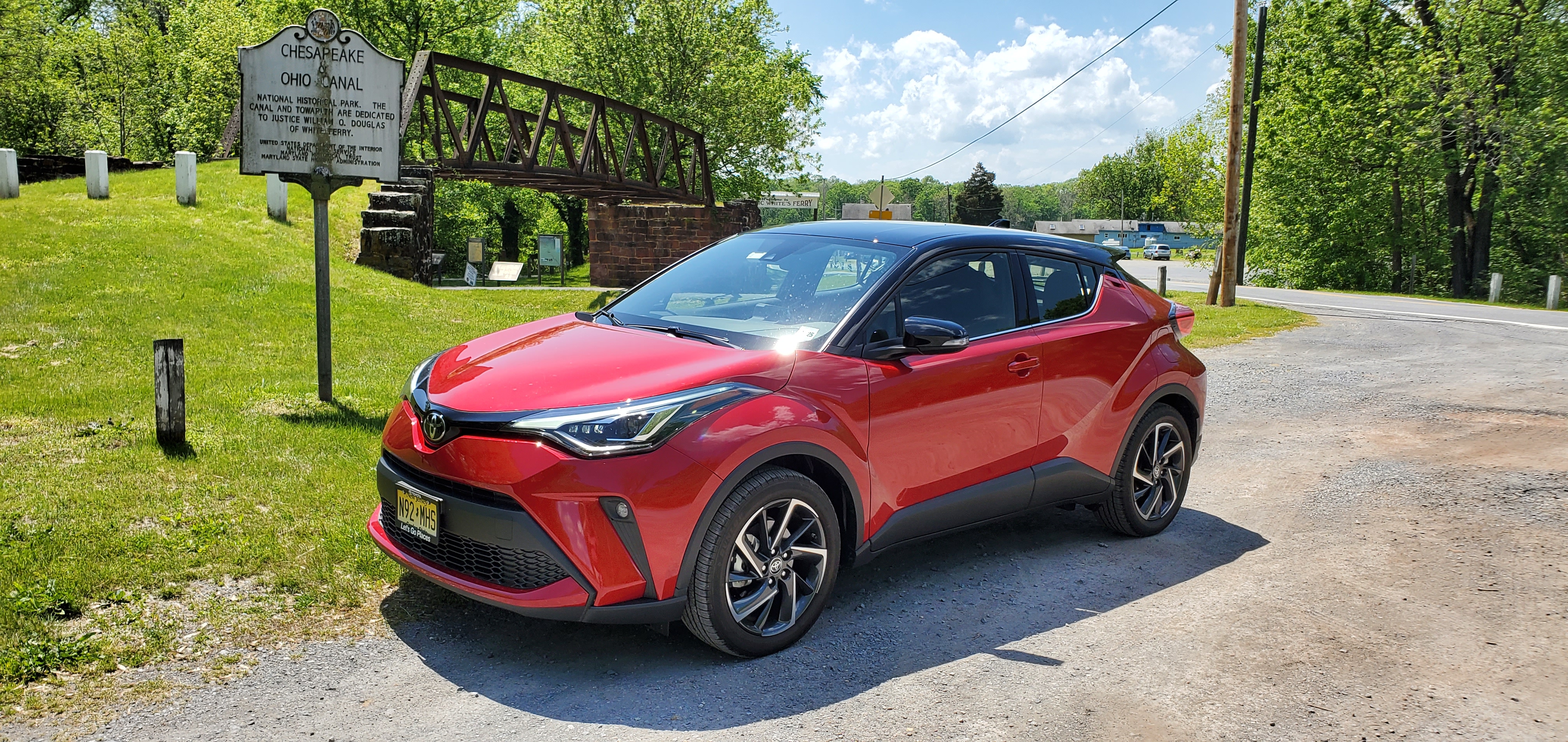 A Supersonic Red with black roof 2020 Toyota C-HR Limited at historic White's Ferry in Maryland on the shores of the Potomac River and the C & O Canal.