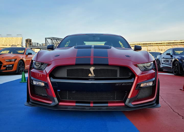 A red SHELBY GT 500 with black hood stripes at Charlotte Motor Speedway ready to be taken out on the track at the North American Track Tour October 19 2020