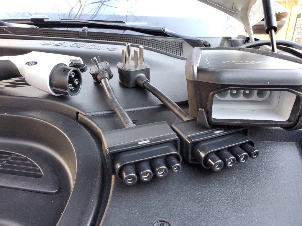 Ford EV plug with a 120 volt and 240 volt plug adaptor