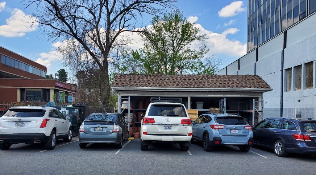 Toyota Land Cruiser in the middle of other modern vehicles.