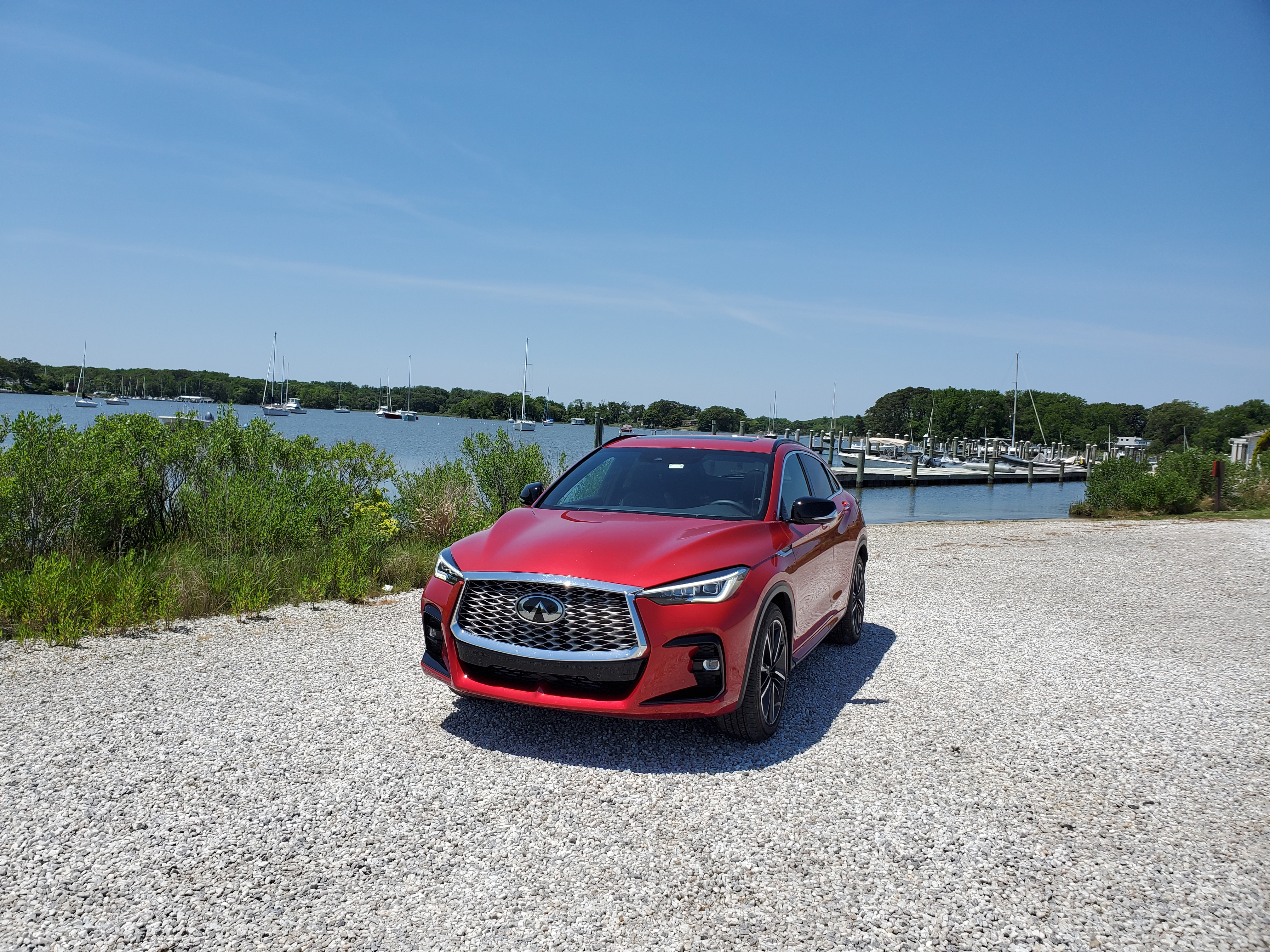 Infiniti QX55 Front on with boats in the background
