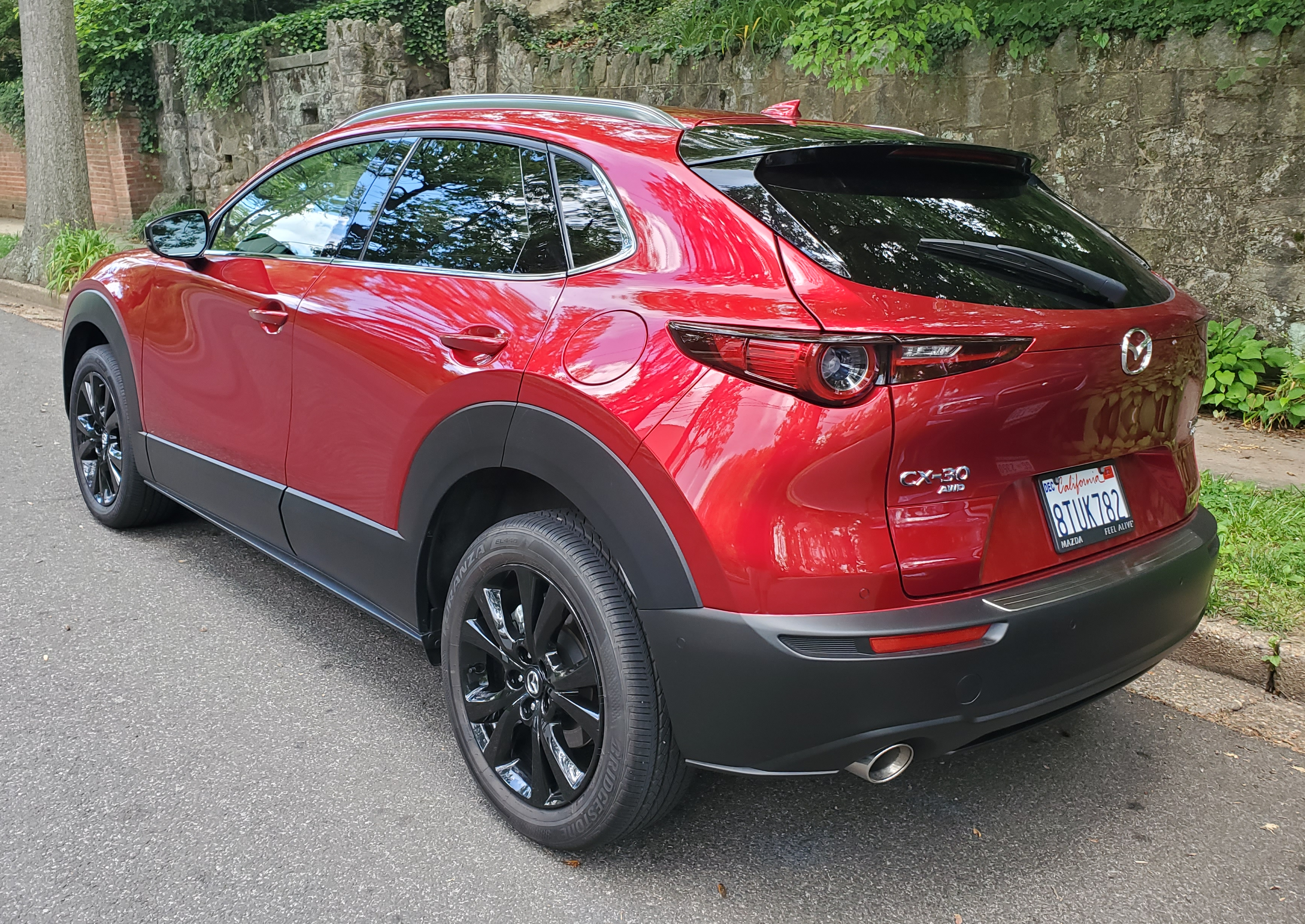 left rear of the mazda cx 30 in soul red crystal metallic