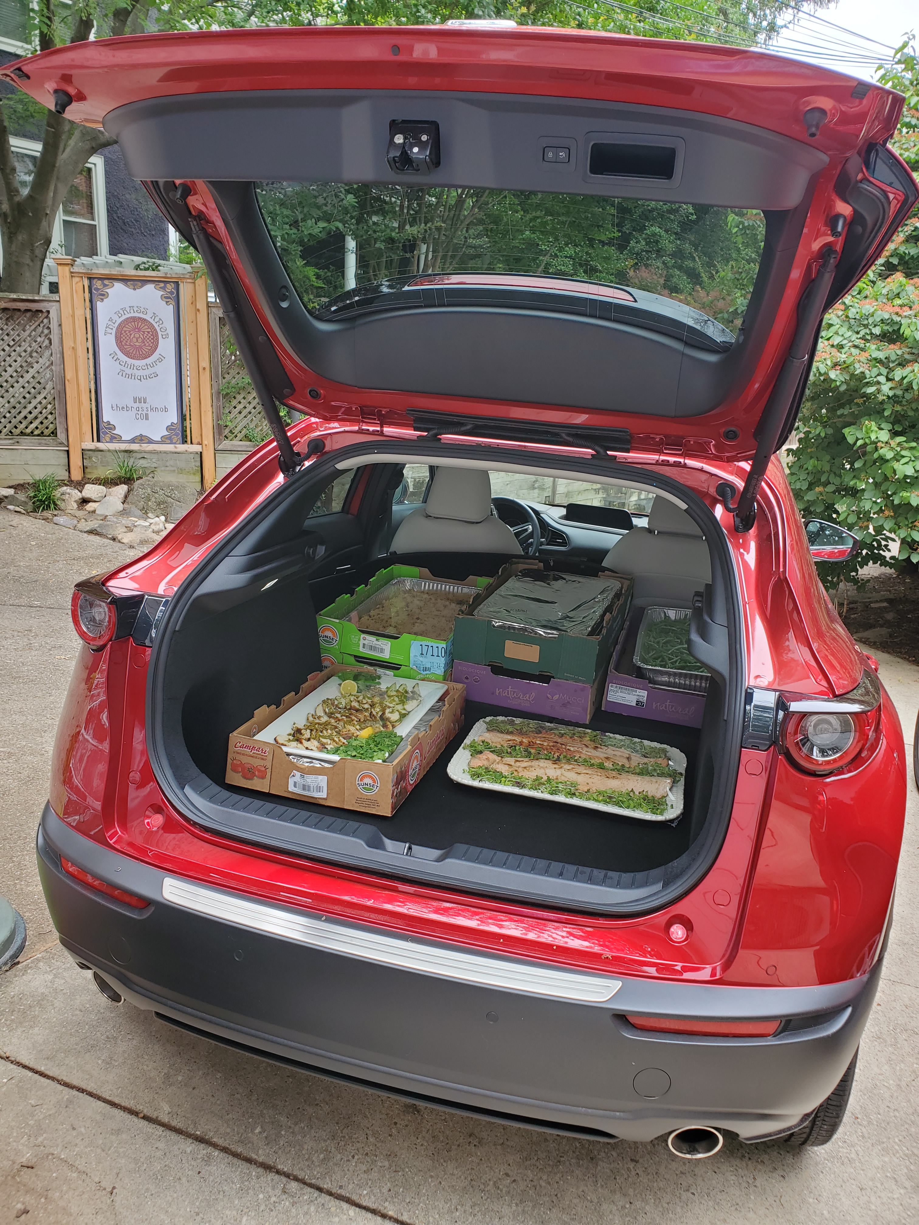 cx30 cargo area loaded with trays of food