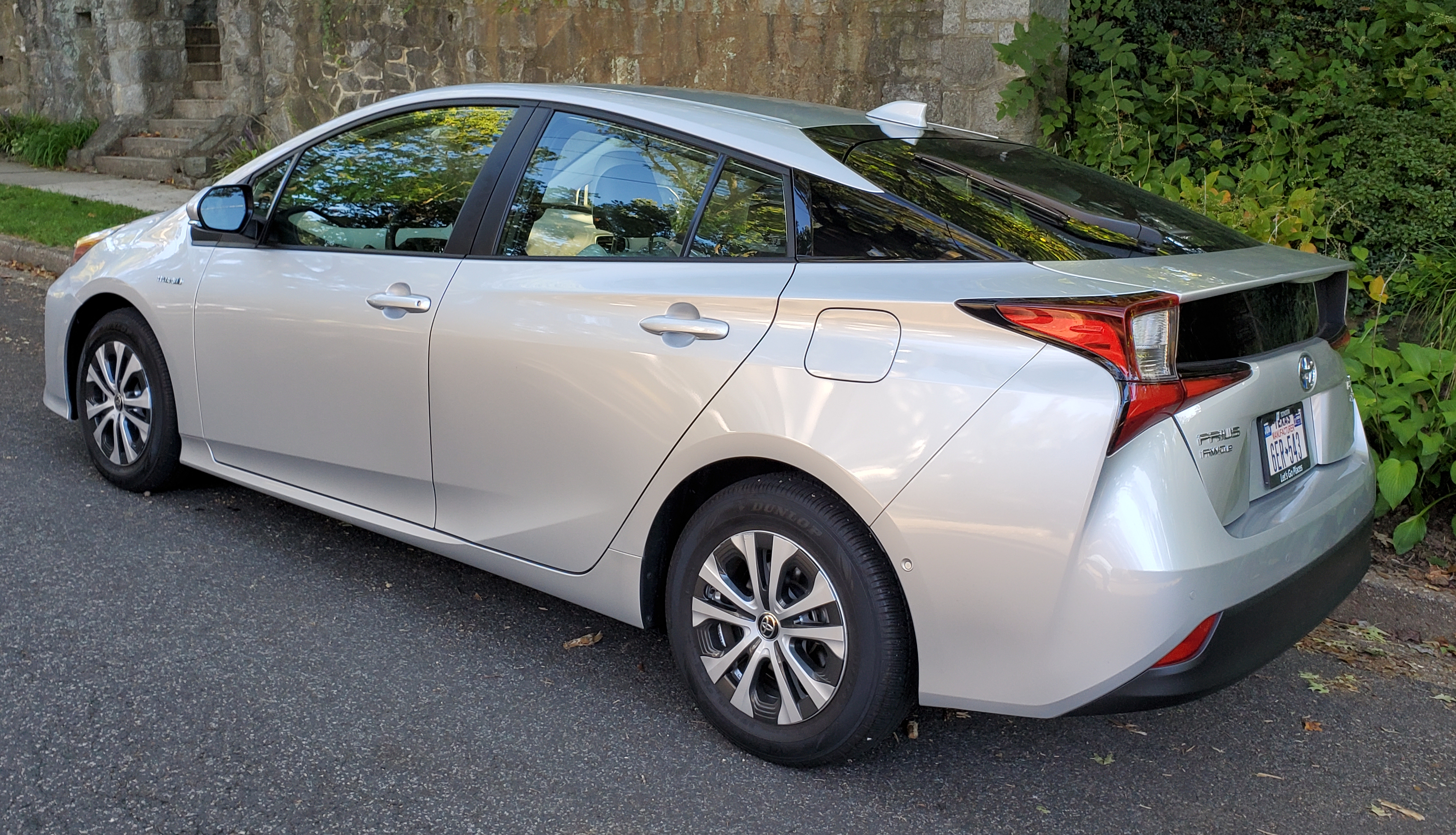 Left rear side view of a 2021 Toyota Prius