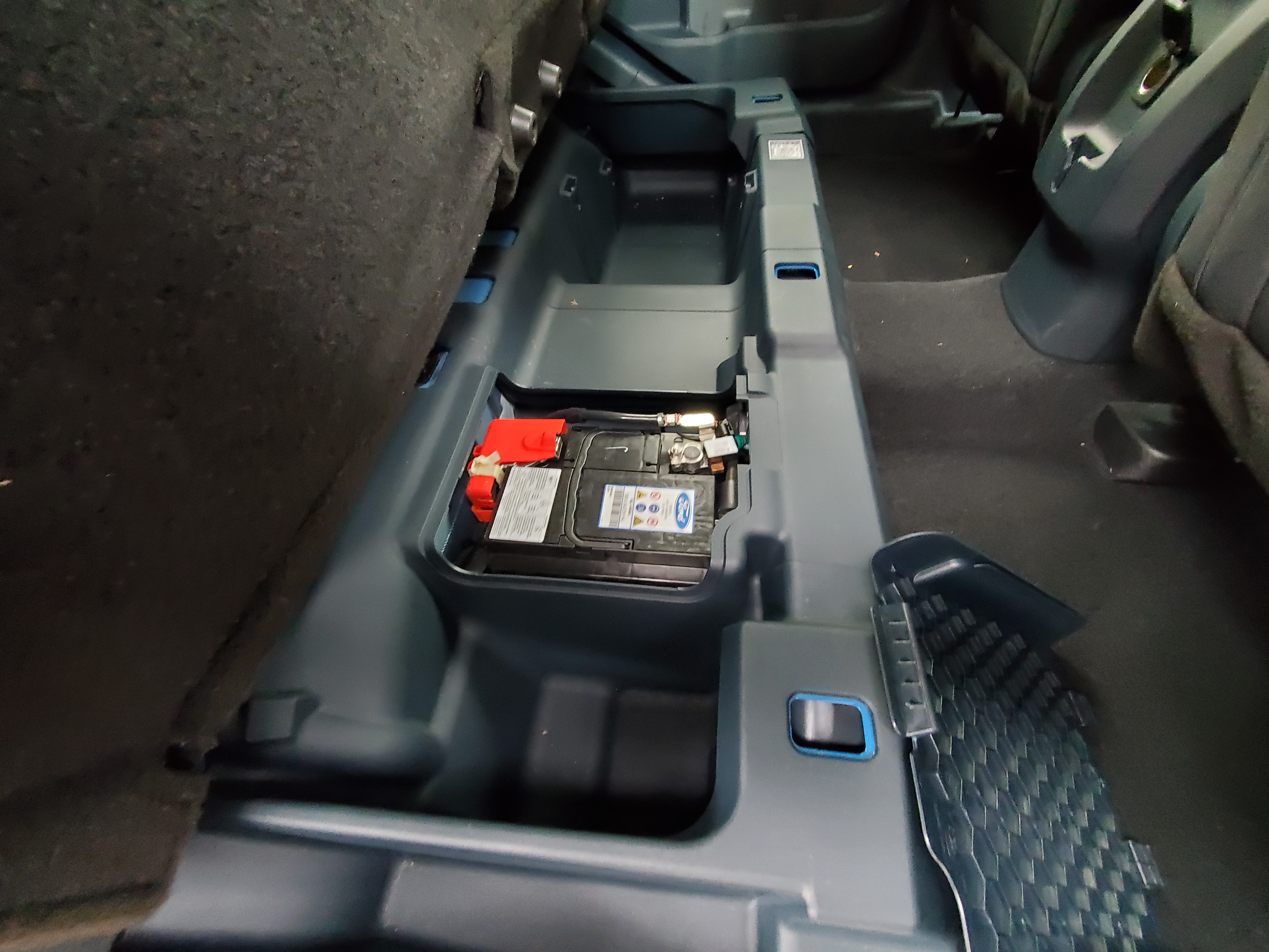 Underneath the rear seats has great storage as well as the 12-volt battery.